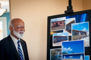 Governor General His Excellency Sir Edmund Lawrence reviews a photo display of the transformation of the building