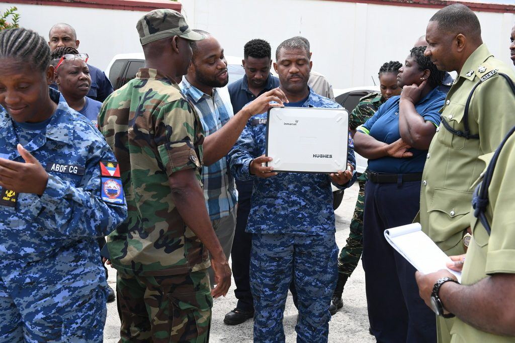 Participants of the 2019/2020 CDRU Training Workshop engage testing a Broadband Global Area Network (BGAN) during the emergency telecommunications exercise.