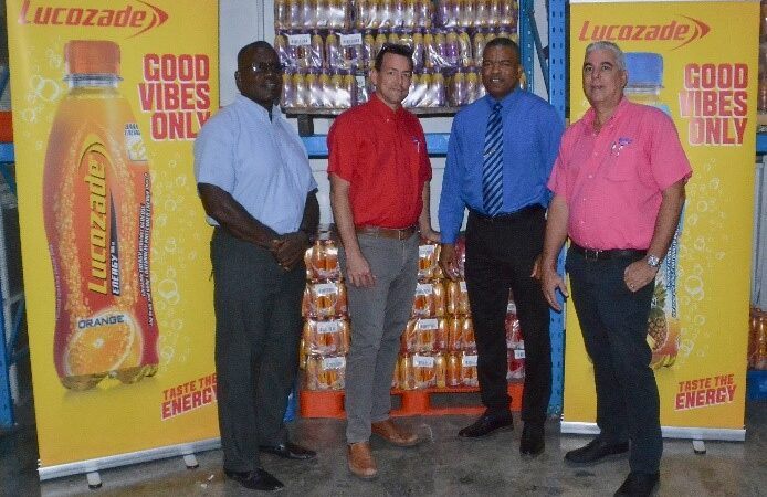 From left: Sgt. David Alleyne, Barry Muster Sales Supervisor at Collins Limited, Acting Inspector Rodney Inniss Police Public Relations Officer, and Michael King Executive Assistant at Collins Limited during the presentation.
