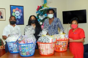 But this year, the company added its adopted school, the Parkinson Memorial Secondary to its gift list and presented Guidance Counsellor <strong>Kara Maynard</strong> with 13 hampers to be delivered to the families of vulnerable students.