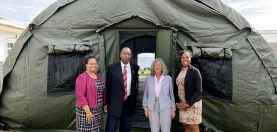 U.S. Ambassador to Barbados and the Eastern Caribbean Linda Taglialatela and Deputy Executive Director of the RSS Graham Archer (center) view one of the donated tents.