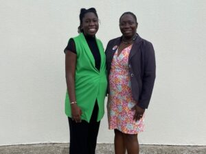 Deputy Public Affairs Officer at U.S. Embassy Bridgetown, Simone Kendall (left) poses with Alicia Payne-Hurley prior to her departure.