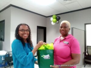<b>Jillian McIntyre</b> known by some in Tourism circles and by others as popular artist, receiving her gift from General Accident's General Manager <b>Wanda Mayers</b></b></b>