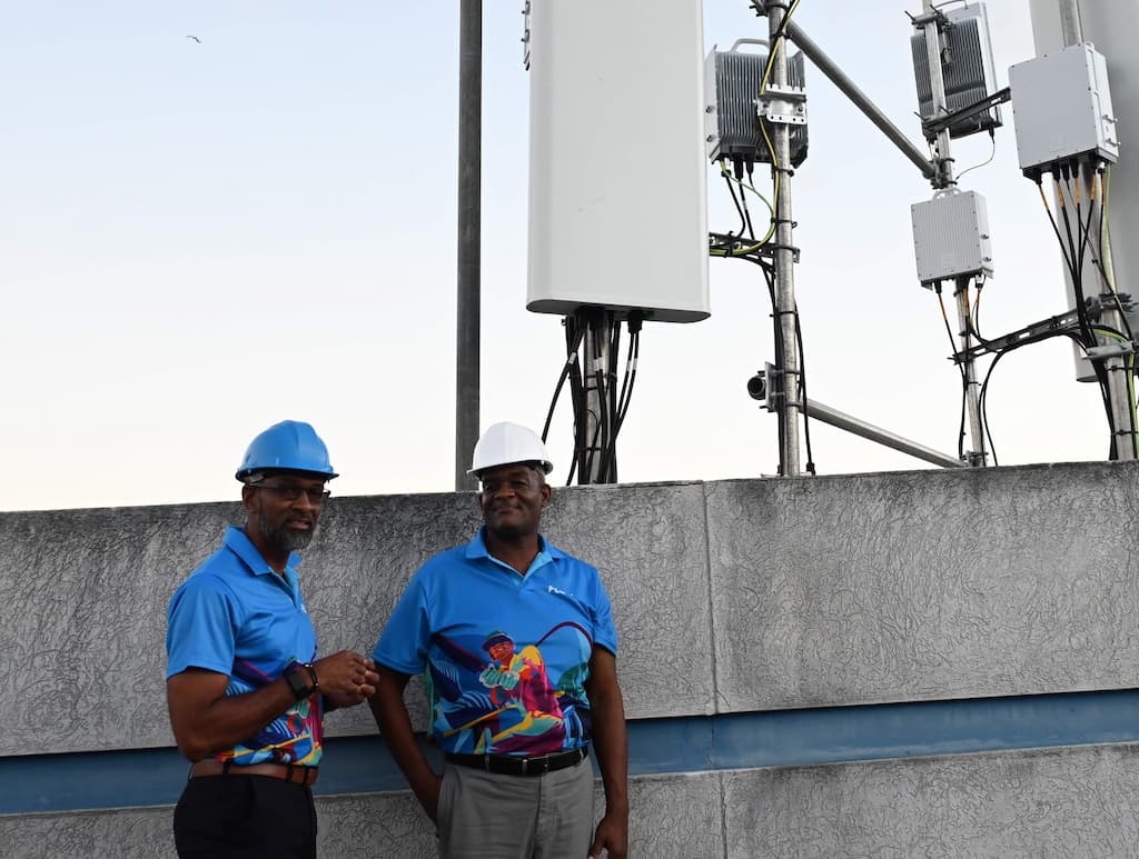 Desron Bynoe, Vice President & General Manager, Flow Barbados (left) chatting with Senior Manager, Technology Oneil Greene at one of the 5G+ sites.