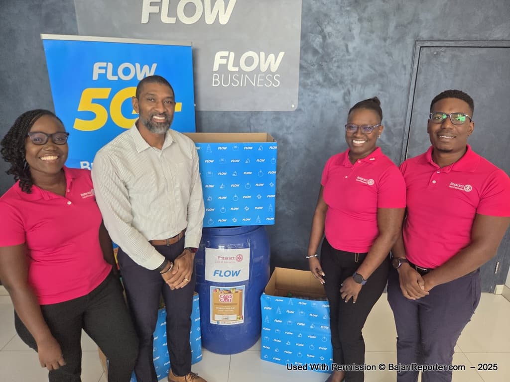 Vice President and General Manager at Flow, Desron Bynoe, (second left) with boxes of food items donated to the Rotaract Club. The Rotaract team from left, president Christina Ruck, director Jamar Mayers and immediate past president Shaunte Carter.
