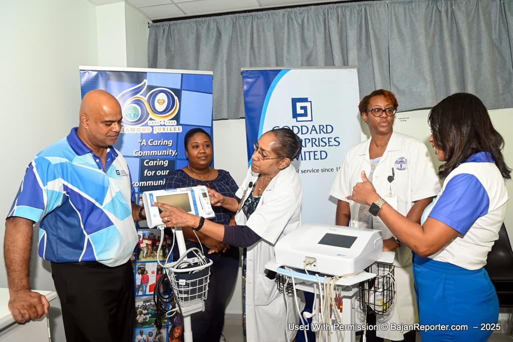 Dr. Anne Marie Cruickshank (centre) explains how the Vital Signs Machine works to Anthony Ali, (left) while Marianna Shepherd looks on as Dr. Joanne Bradford-King (second right) and Lee-Ann Millar Mendes the Group VP of HR and Shared Services at GEL engage about the ECG machine.