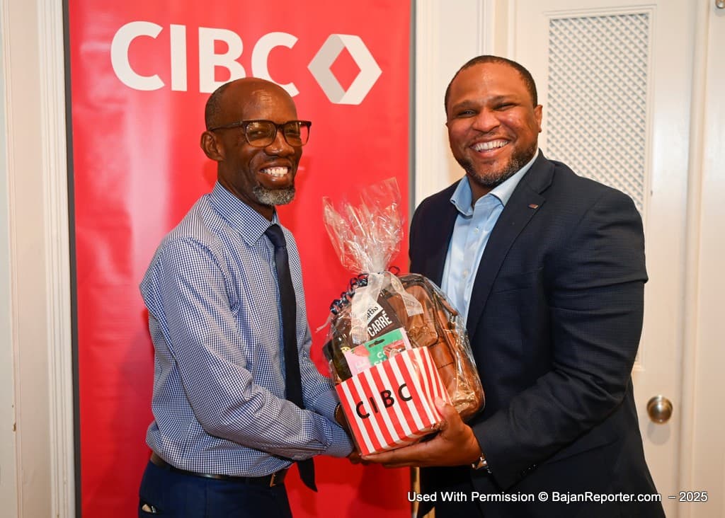 Kemar Polius, head of country for the bank’s Barbados operations presents William Warner, Barbados’ director of the Bureau of Gender Affairs Warner with a token of appreciation.