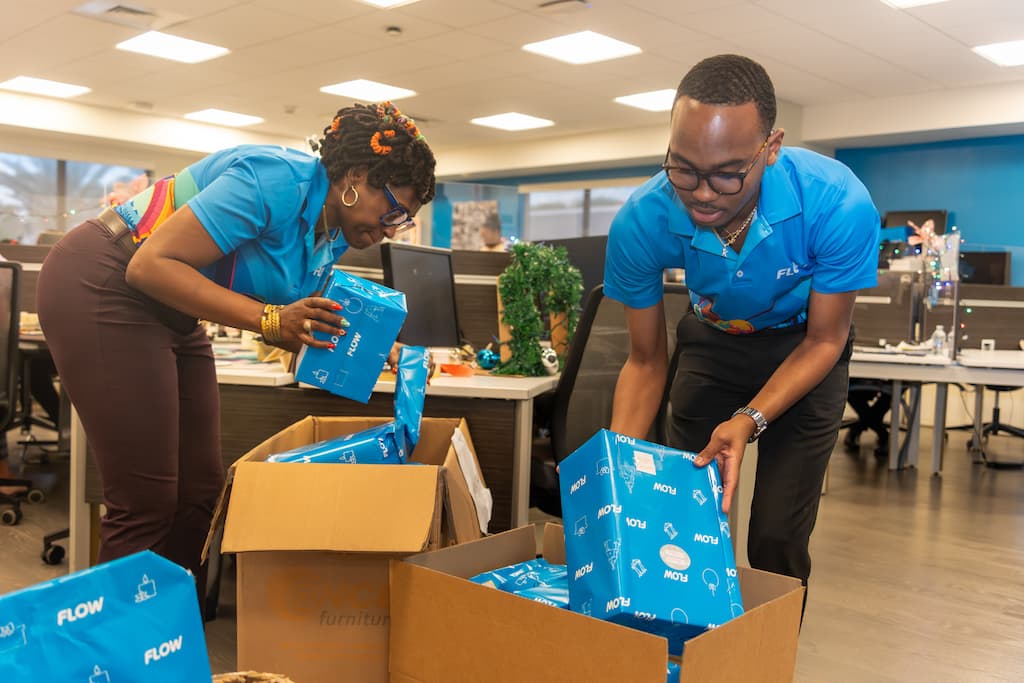 Flow staff packing up some of the gifts. Over 120 gifts were donated.